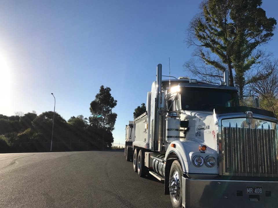 Hancock Excavations Kenworth tipper truck on a suburban road near Wetherill Park