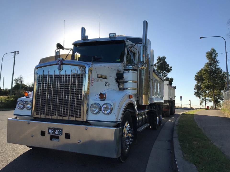 Kenworth prime mover with a tipper trailer parked on a roadside in Western Sydney
